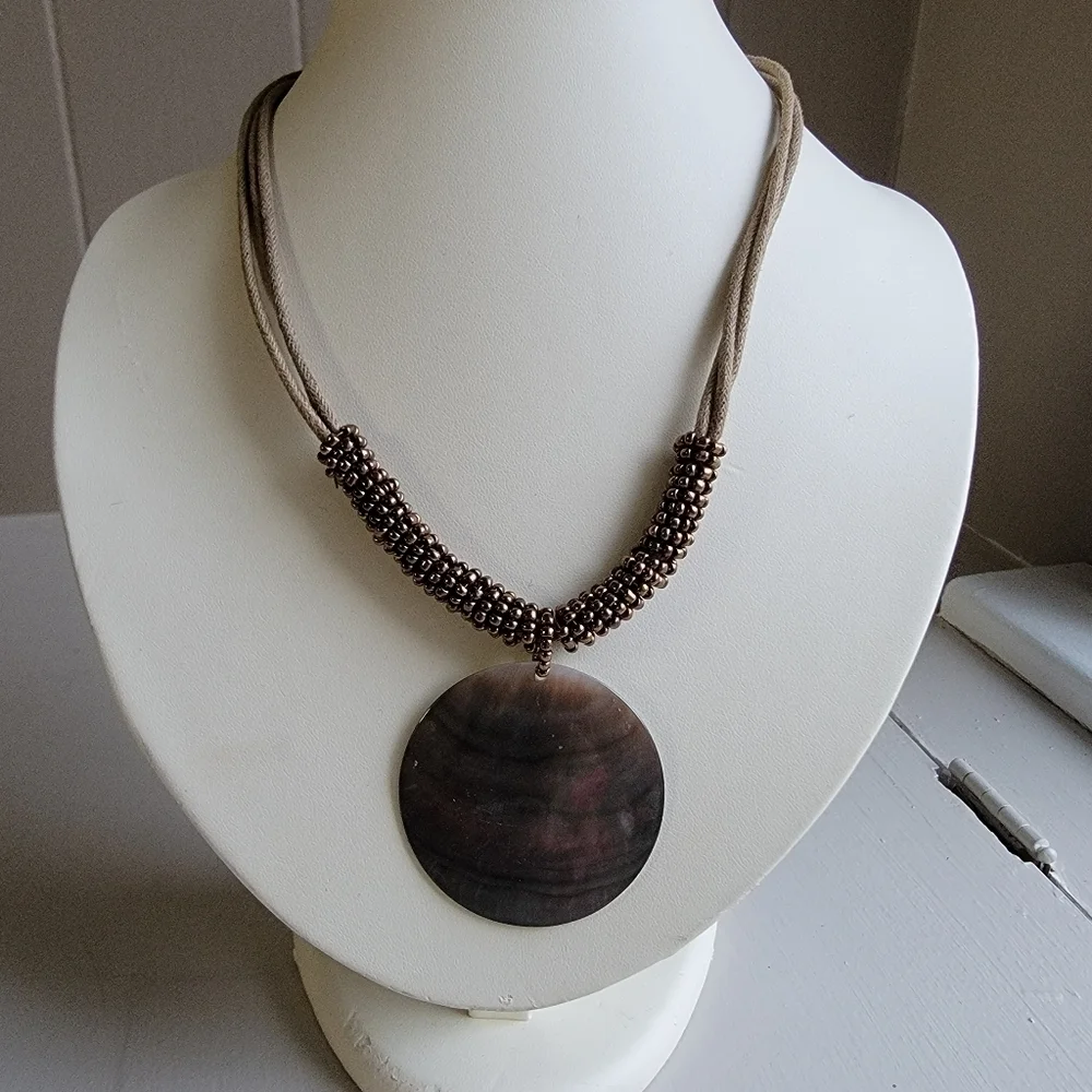 Shell necklace with beadwork and leather rope necklace